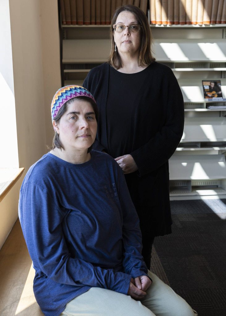 Emerson Elementary School student parents Dana Sanders and Jennifer Phillips McLellan at the Everett Public Library on Wednesday, April 16, 2025 in Everett, Washington. (Olivia Vanni / The Herald)