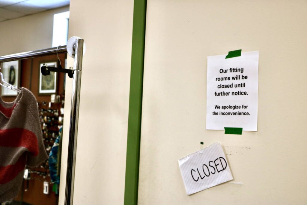 Signs warn customers that fitting rooms are closed until further notice at Bellas Voice on Friday, April 25, 2025, in Lynnwood, Washington. The thrift store had to close its fitting rooms a couple weeks ago after extensive shoplifting issues. (Aspen Anderson / The Herald)