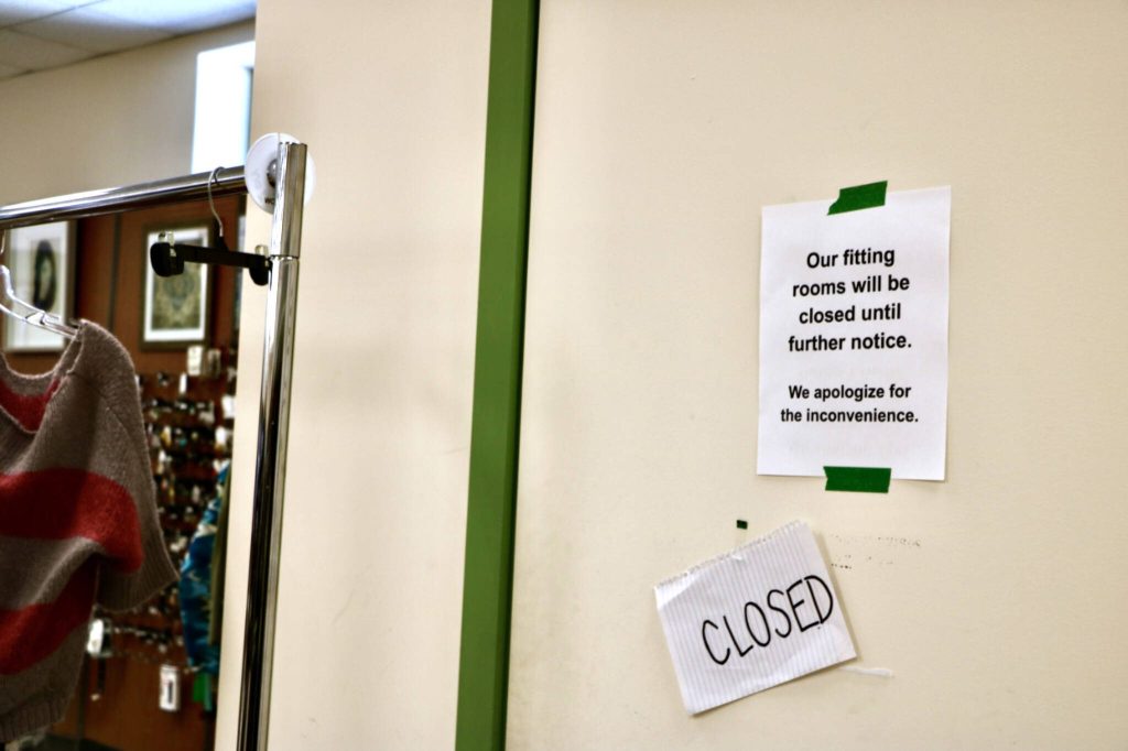 A sign is taped to a fitting room door at Bellas Voice in Lynnwood, Washington. The fitting rooms a couple weeks ago after extensive shoplifting issues. (Aspen Anderson / The Herald)