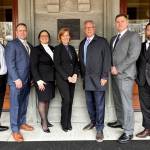 Plaintiffs and their attorneys pose for a photo during oral arguments at the U.S. Ninth Circuit Court of Appeals at the Pioneer Courthouse on April 3 in Portland, Oregon. Left to right, firefighter Ryan Stupey, firefighter/driver-operator David Petersen, Lauren Petersen, attorney Jennifer W. Kennedy, attorney Alan Reinach, firefighter Lt. Jay Stickney, and firefighter/tillerman Kevin Gleason. (Photo provided)