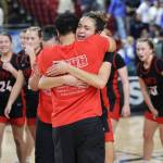 Kaleo Anderson hugs King's girls basketball head coach Dan Taylor after hitting a game-winner against Lynden Christian in a March 7, 2025 1A state semi-final game at the Yakima Valley SunDome. (Courtesy of King's Athletics / Donna Beard)