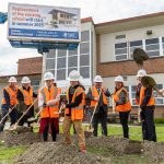 Students Haddie Shorb, 9, left, and brother Elden Shorb, 11, right, lead the ground breaking at Jackson Elementary School on Tuesday, April 1, 2025 in Everett, Washington. (Olivia Vanni / The Herald)