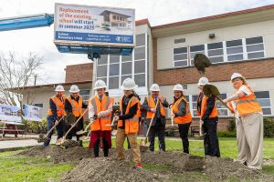 Students Haddie Shorb, 9, left, and brother Elden Shorb, 11, right, lead the ground breaking at Jackson Elementary School on Tuesday, April 1, 2025 in Everett, Washington. (Olivia Vanni / The Herald)