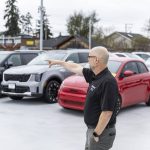 Sales Manger Erik Butler talks about their inventory at Kia of Everett on Tuesday, April 1, 2025 in Everett, Washington. (Olivia Vanni / The Herald)