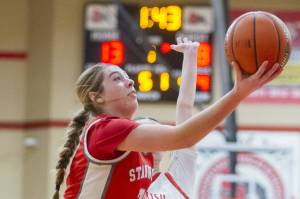 Stanwood's Ellalee Wortham tries to make a one-handed layup during the game against Snohomish on Thursday, Jan. 9, 2025 in Snohomish, Washington. (Olivia Vanni / The Herald)