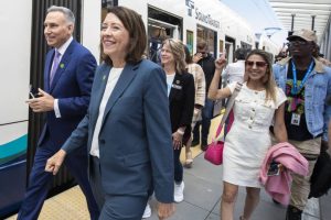 King County Executive Dow Constantine and Senator Maria Cantwell walk through the Lynnwood Center Station to board the 12:30 pm train during the Lynnwood 1 Line extension opening celebrations on Friday, Aug. 30, 2024 in Lynnwood, Washington. (Olivia Vanni / The Herald)