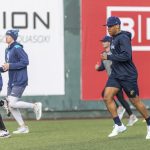 AquaSox players warm up before the start of practice at Funko Field on Tuesday, April 1, 2025 in Everett, Washington. (Olivia Vanni / The Herald)