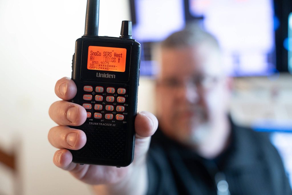 Daron Johnson holds up a scanner on Tuesday, April 1 in Everett, Washington. (Will Geschke / The Herald)