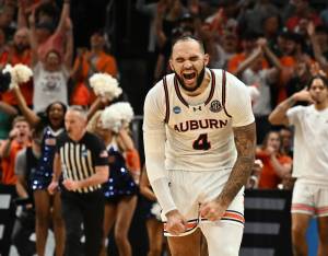 Auburn's Johni Broome celebrates after returning to the game after an injury and sinking a 3-point basket in the second half. (Daniel Mears / The Detroit News / Tribune News Services)