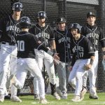 Jackson players celebrate teammate MJ Holcomb scoring during the game against Edmonds-Woodway on Wednesday, April 2, 2025 in Edmonds, Washington. (Olivia Vanni / The Herald)