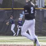 Edmonds-Woodways Toshi Gilginas makes a diving catch in the outfield and celebrates with teammate Lukas Wanke during the game against Jackson on Wednesday, April 2, 2025 in Edmonds, Washington. (Olivia Vanni / The Herald)