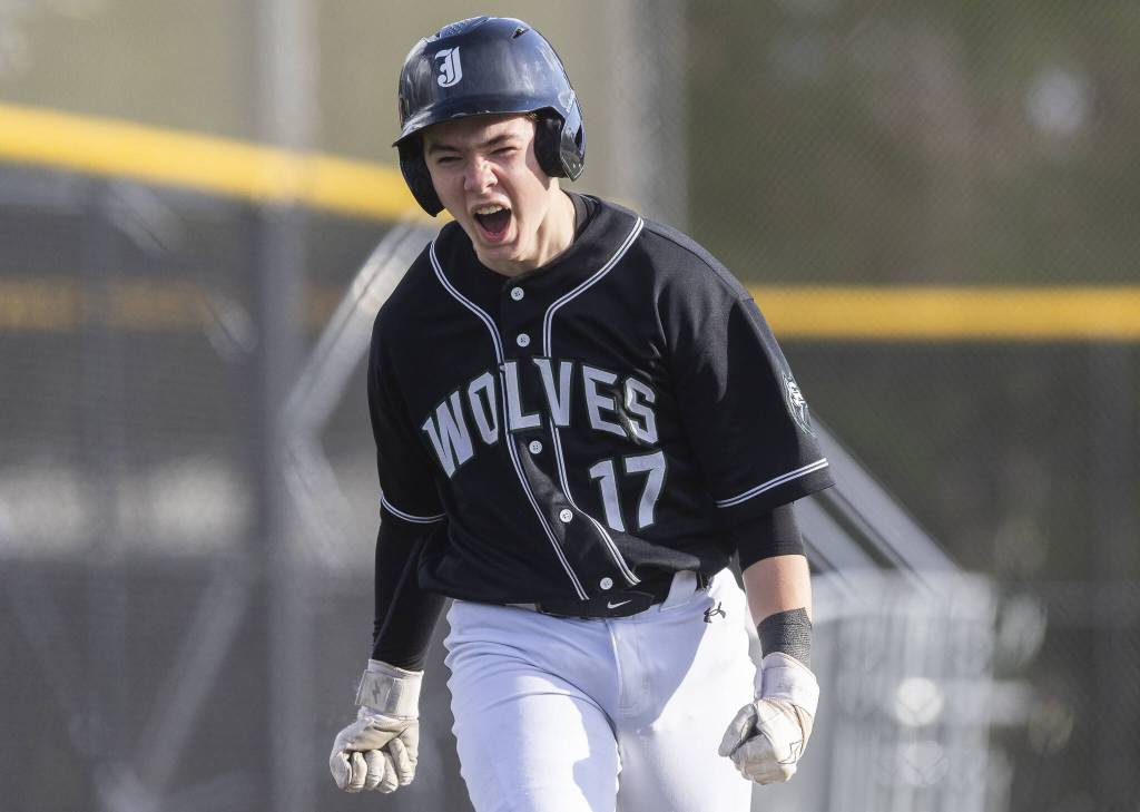 Jacksons Gavin Duckart yells as he makes his way toward home plate after being hit in by a homer from his teammate Sam Craig during the game against Edmonds-Woodway on Wednesday, April 2, 2025 in Edmonds, Washington. (Olivia Vanni / The Herald)