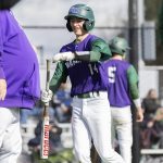 Edmonds-Woodways Toshi Gilginas smiles and fist bumps his coach after scoring during the game against Jackson on Wednesday, April 2, 2025 in Edmonds, Washington. (Olivia Vanni / The Herald)