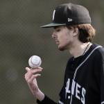 Jacksons Drew Pepin balances the ball on his fingers while waiting for the the next batter during the game against Edmonds-Woodway on Wednesday, April 2, 2025 in Edmonds, Washington. (Olivia Vanni / The Herald)