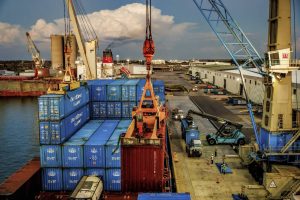 Longshoremen offload containers from the Queen B at Port Manatee in Palmetto, Fla., April 1, 2025. Businesses that had ordered the cargo on the vessel were doing all they could to get their purchases through U.S. customs before Wednesday, to ensure that they would not have to pay the new, higher levies. (Scott McIntyre/The New York Times)