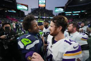 Vikings quarterback Sam Darnold, right, greets Seahawks quarterback Geno Smith after Minnesota's win in Seattle on Dec. 22, 2025. (Anthony Souffle / The Minnesota Star Tribune / Tribune News Services)