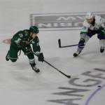Everett Silvertips forward Nolan Chastko (19) skates towards a loose puck in the neutral zone while being pursued by Seattle Thunderbirds forward Nathan Pilling during Everett's 7-4 win in Game 5 of the WHL Playoffs First Round at Angel of the Winds Arena in Everett, Washington on April 5, 2025. (Joe Pohoryles / The Herald)