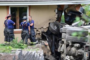 South County Fire and Rescue crews responded after a dump truck crashed into an Edmonds home and knocked out power lines last September. (Courtesy of South County Fire)