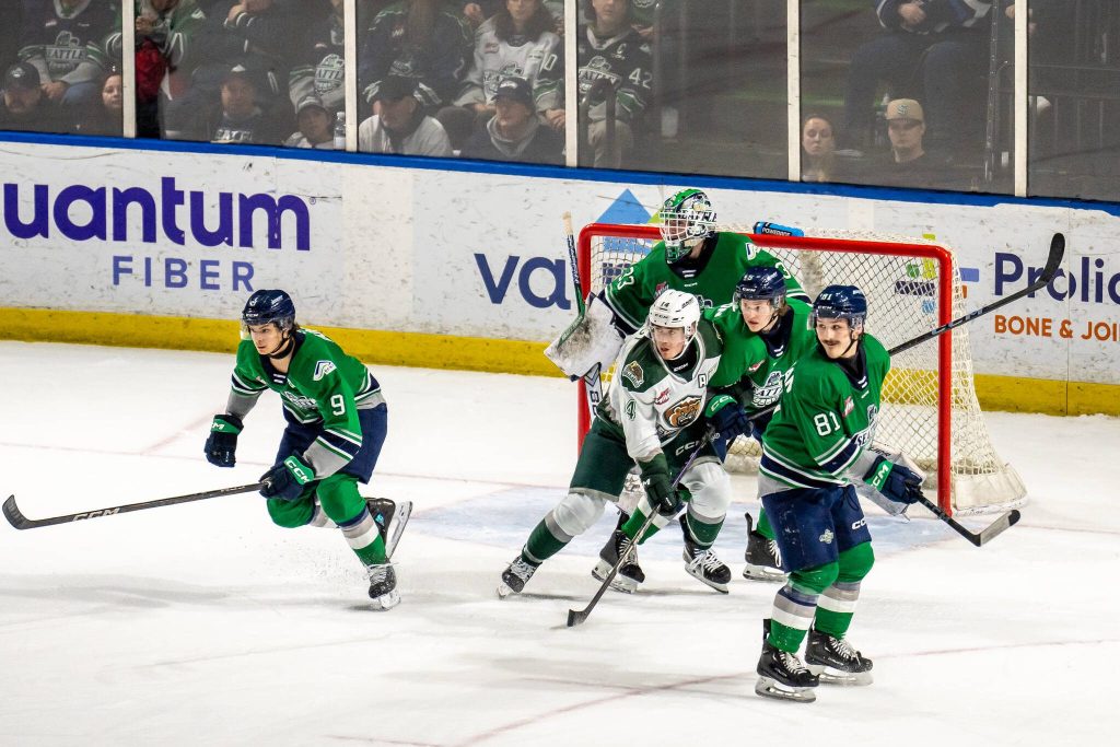 Everett Silvertips forward Austin Roest positions himself in front of Seattle Thunderbirds goalie Scott Ratzlaff and between (from left to right) Coster Dunn, Hyde Davidson and Brayden Schuurman during Everett's 1-0 double overtime win against Seattle in Game 6 of the WHL Playoffs First Round at accesso ShoWare Center in Kent, Washington on April 7, 2025. (Photo Courtesy: Dexter Guiang / Come as You Are Hockey)