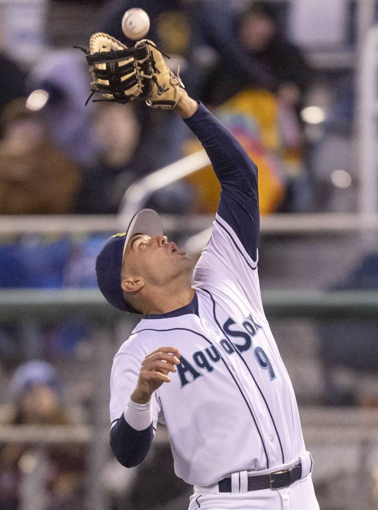 Everett AquaSox first baseman Brandon Eike catches a pop fly during the Opening Day game against the Hillsboro Hops on Tuesday, April 8, 2025 in Everett, Washington. (Olivia Vanni / The Herald)