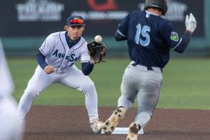 Everett AquaSox shortstop Colt Emerson catches the ball at second base for the first out in a double play during the Opening Day game against the Hillsboro Hops on Tuesday, April 8, 2025 in Everett, Washington. (Olivia Vanni / The Herald)