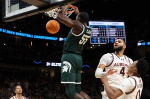 Michigan State forward Coen Carr (55) dunks the ball during an NCAA Men's Basketball Tournament Elite Eight game at State Farm Arena in Atlanta, Georgia on Sunday, March 30, 2025. (Neil Blake / Tribune News Services)