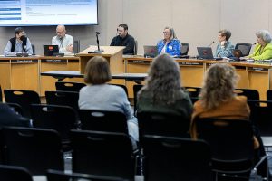 The Edmonds School Board discusses budget cuts during a school board meeting on Tuesday, April 15, 2025 in Edmonds, Washington. (Olivia Vanni / The Herald)