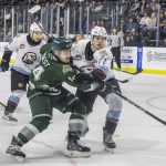 Everett Silvertips forward Austin Roest scrambles after a loose puck infant of the goal during the second round WHL playoff game against the Portland Winterhawks on Friday, April 11, 2025 in Everett, Washington. (Olivia Vanni / The Herald)