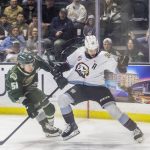 Everett Silvertips forward Jaxsin Vaughan grades the jersey of Portland Winterhawks Ryder Thompson during the second round WHL playoff game on Friday, April 11, 2025 in Everett, Washington. (Olivia Vanni / The Herald)