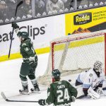 Everett Silvertips forward Austin Roest raises his stick in the air incelebrationa after scoring a goal during a power play to tie up the game during the second round WHL playoff game against the Portland Winterhawks on Friday, April 11, 2025 in Everett, Washington. (Olivia Vanni / The Herald)
