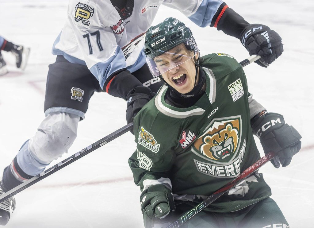 Everett Silvertips forward Zackary Shantz as he is checked int he back during the second round WHL playoff game against the Portland Winterhawks on Friday, April 11, 2025 in Everett, Washington. (Olivia Vanni / The Herald)