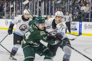 Everett Silvertips’ forward Austin Roest scrambles after a loose puck infant of the goal during the second round WHL playoff game against the Portland Winterhawks on Friday, April 11, 2025 in Everett, Washington. (Olivia Vanni / The Herald)