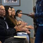 People clap as Casino Road residents share their thoughts and concerns to the Everett City Council on Wednesday, April 16, 2025 in Everett, Washington. (Olivia Vanni / The Herald)