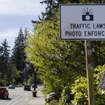 A sign alerts drivers to a traffic camera along 100th Avenue West on Monday, April 14, 2025 in Edmonds, Washington. (Olivia Vanni / The Herald)
