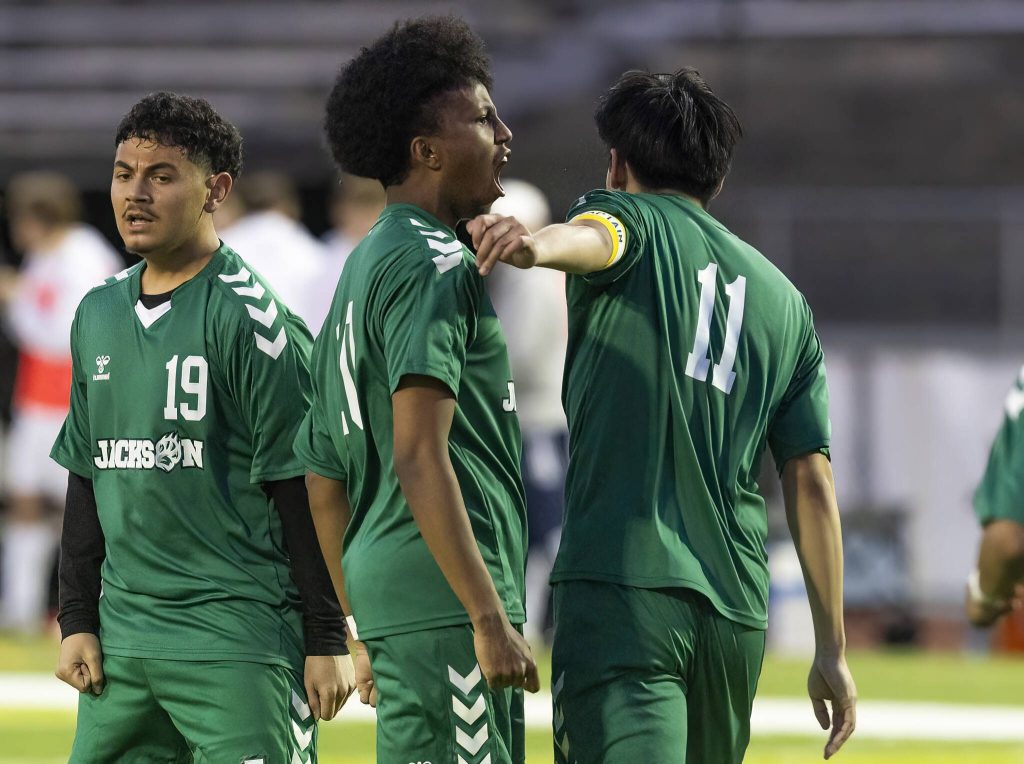 Jacksons Chris Abyot yells in celebration after his teammate Jacksons Connor Huynh scores during the game against Glacier Peak on Tuesday, April 15, 2025 in Everett, Washington. (Olivia Vanni / The Herald)