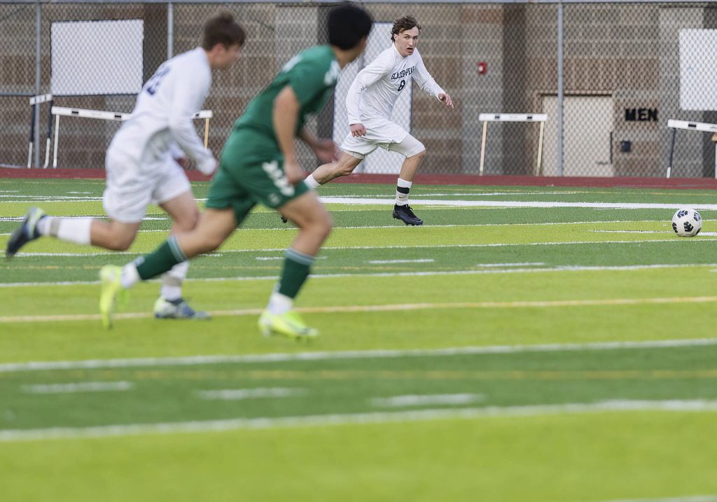 Glacier Peaks Otto Nicholson takes the ball down the open field during the game against Jackson on Tuesday, April 15, 2025 in Everett, Washington. (Olivia Vanni / The Herald)
