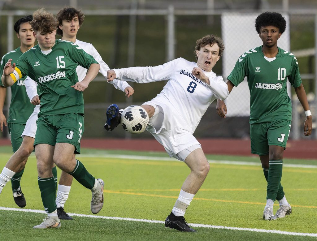 Glacier Peaks Otto Nicholson takes a volley shot on goal during the game against Jackson on Tuesday, April 15, 2025 in Everett, Washington. (Olivia Vanni / The Herald)