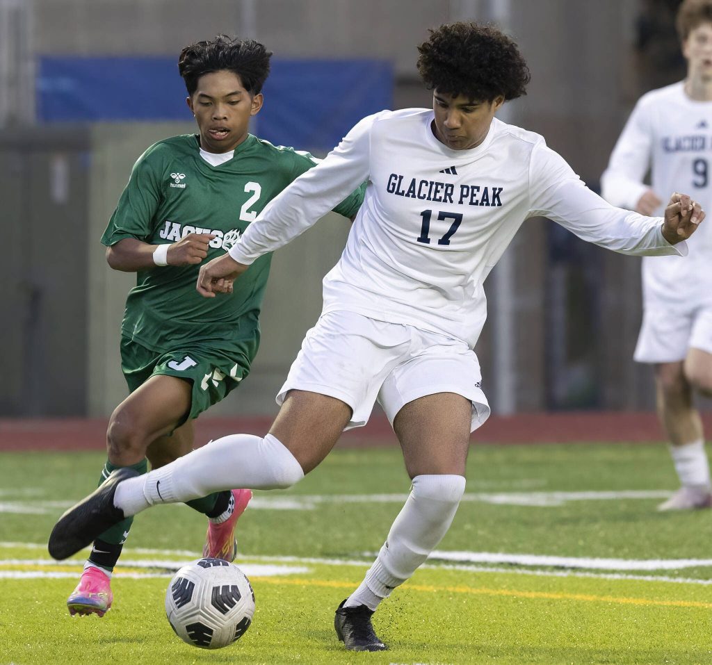 Glacier Peaks Joziah Coppin kicks the ball clear of the goal box during the game against Jackson on Tuesday, April 15, 2025 in Everett, Washington. (Olivia Vanni / The Herald)