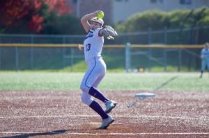 Edmonds-Woodway senior Ella Campbell winds up to deliver a pitch against Archbishop Murphy in the Warriors' 9-2 win in Edmonds, Washington on April 16, 2025. (Joe Pohoryles / The Herald)