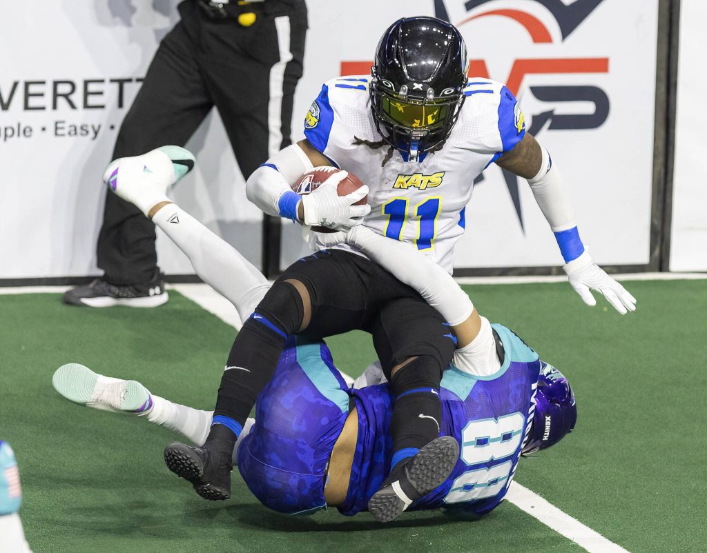 Washington Wolfpacks Jalon Minney tackles Nashville Kats Antwane Grant during the game on Thursday, April 17, 2025 in Everett, Washington. (Olivia Vanni / The Herald)