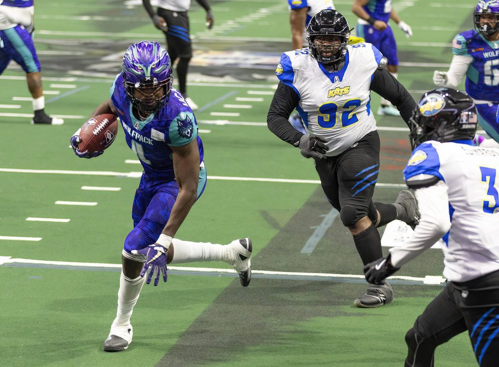 Washington Wolfpacks Ledarian McAllister runs the ball in for a touchdown during the game against the Nashville Katson Thursday, April 17, 2025 in Everett, Washington. (Olivia Vanni / The Herald)