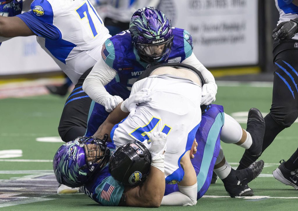 Washington Wolfpacks Antonio Simley sacks the Nashville Kats quarterback during the game on Thursday, April 17, 2025 in Everett, Washington. (Olivia Vanni / The Herald)