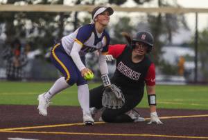 Everett’s Anna Luscher (6) gets an out at second during a Class 3A District 1 softball championship game between Snohomish and Everett at Phil Johnson Fields in Everett, Washington on Thursday, May 16, 2024. Everett won, 10-0. (Annie Barker / The Herald)