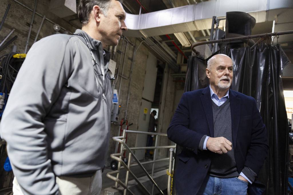 Edmonds Public Works Director Phil Williams, right, and President and Chief Technology Officer of EcoRemedy David Mooney talk at the Edmonds Wastewater Treatment Plant on Thursday, April 17, 2025 in Edmonds, Washington. (Olivia Vanni / The Herald)