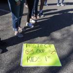 Over a dozen parents and some Snohomish School District students gather outside of the district office to protest and discuss safety concerns after an incident with a student at Machias Elementary School on Friday, April 18, 2025 in Snohomish, Washington. (Olivia Vanni / The Herald)