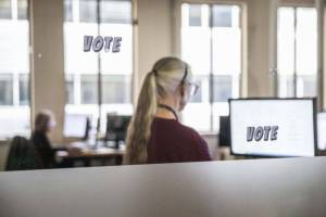 Snohomish County Elections employees check signatures on ballots on Tuesday, Oct. 29, 2024 in Everett , Washington. (Olivia Vanni / The Herald)