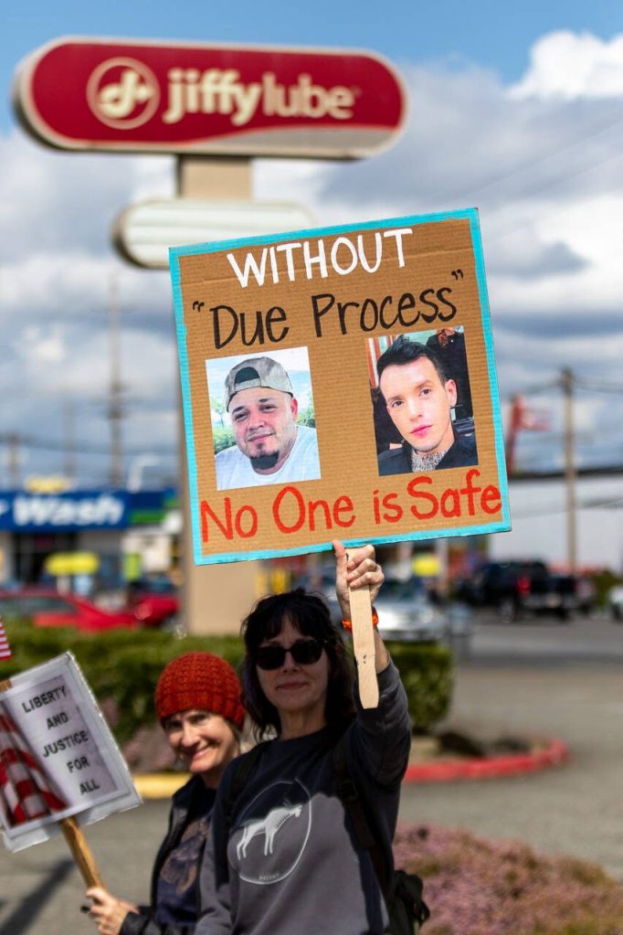 Protesters line Broadway on Saturday, April 19, 2025, in Everett, Washington. (Aaron Kennedy / The Herald)