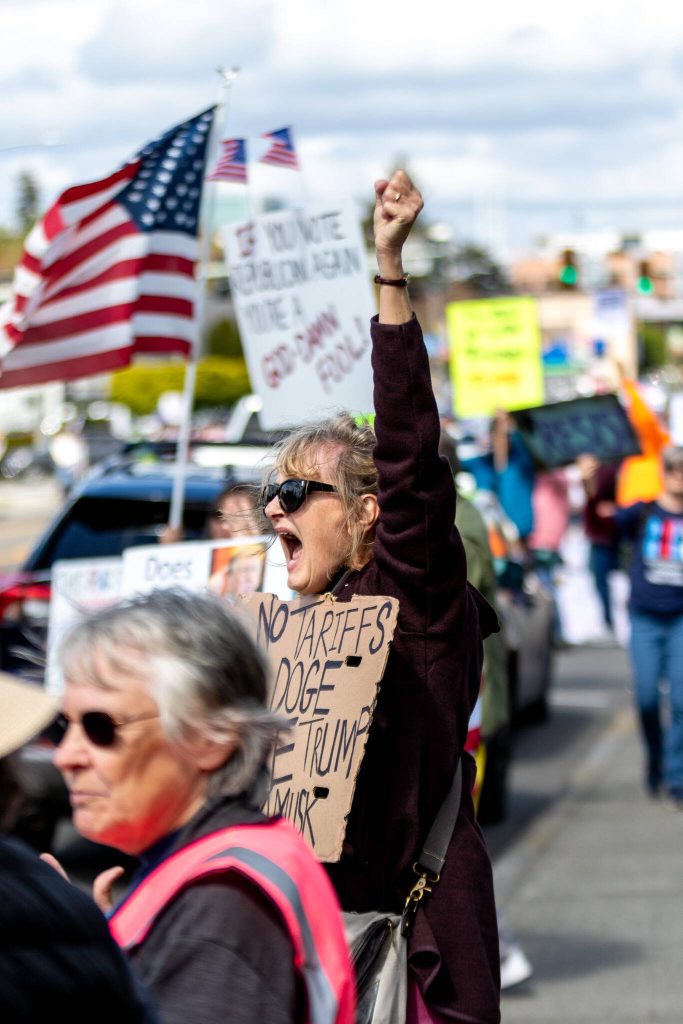 Protesters line the Broadway on Saturday afternoon in Everett. (Aaron Kennedy / The Herald)