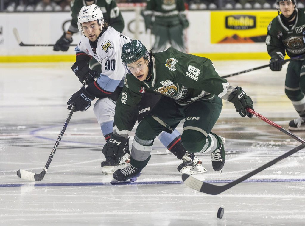 Everett Silvertips forward Zackary Shantz scrambles after the puck during game seven of the second round of the WHL playoffs against the Portland Winterhawks on Tuesday, April 22, 2025 in Everett, Washington. (Olivia Vanni / The Herald)