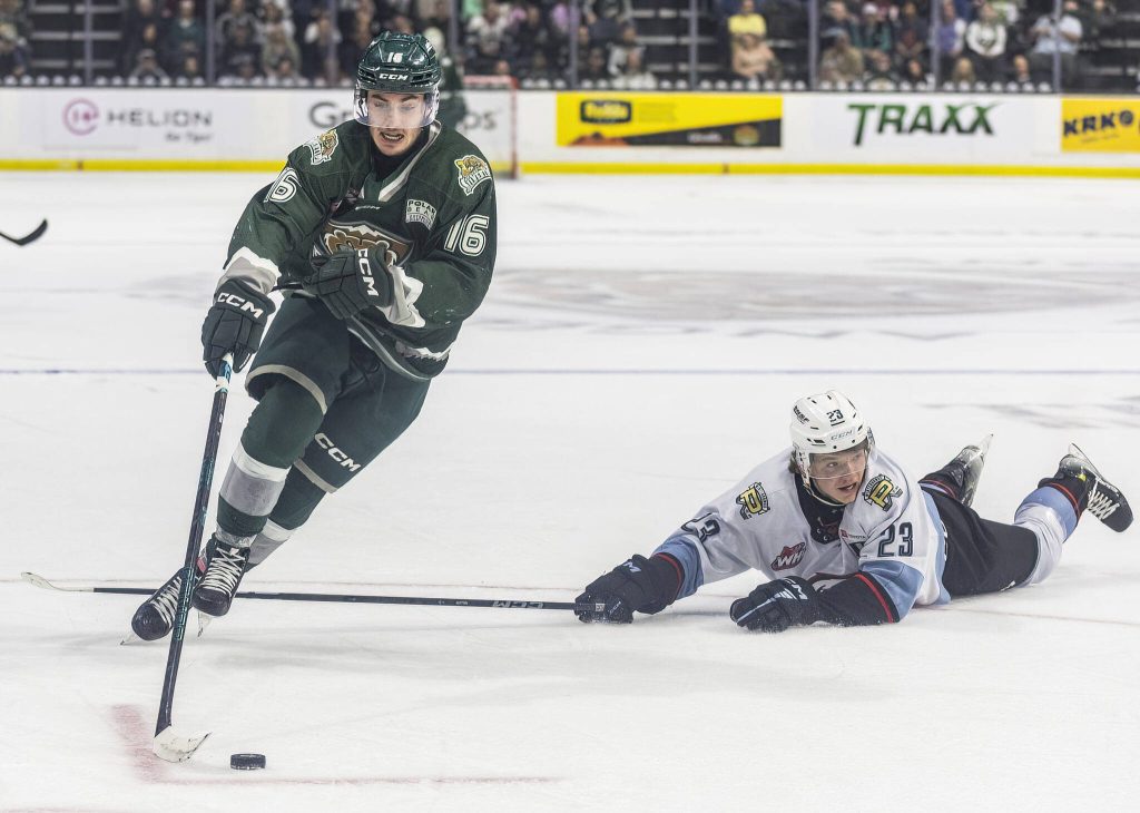 Everett Silvertips forward Dominik Rymon skates over the outstretched stick of Portland Winterhawks Ryan Miller during game seven of the second round of the WHL playoffs on Tuesday, April 22, 2025 in Everett, Washington. (Olivia Vanni / The Herald)